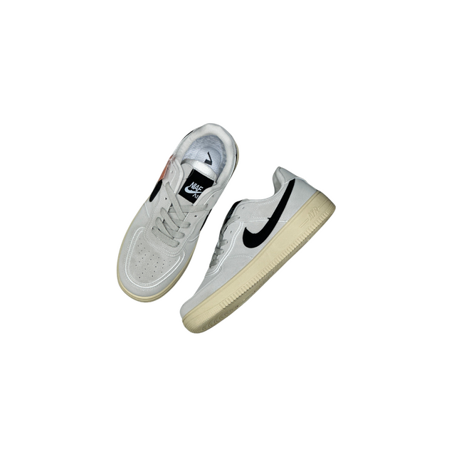 White sneakers with a black logo on a white background