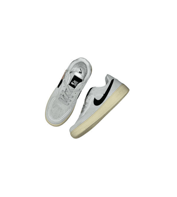 White sneakers with a black logo on a white background