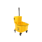 Yellow mop bucket with wheels on a white background