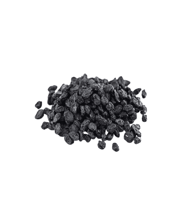 Pile of dark raisins on a white background